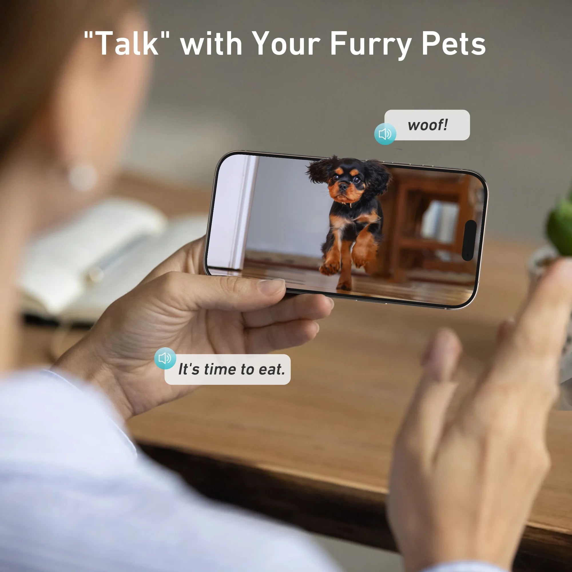 Person using a smartphone with a dog app showing a dog and text messages on the screen.