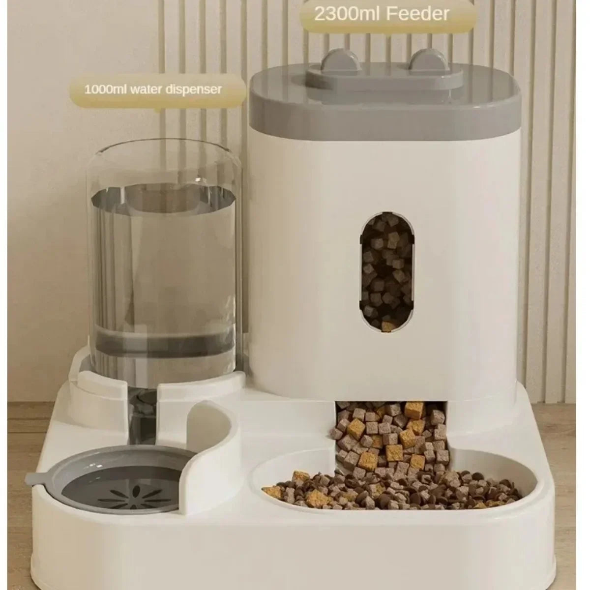 Pet feeding and water station with separate compartments for food and water on a neutral background.