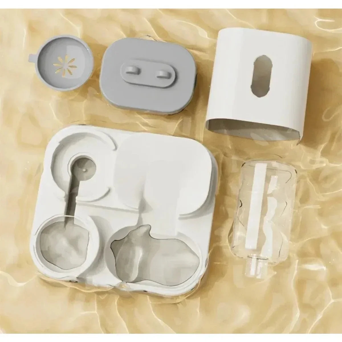 Set of gray silicone kitchen molds on a beige fabric background