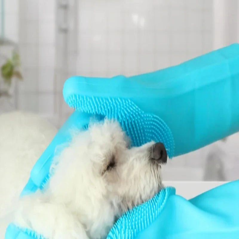Dog being bathed with a blue grooming glove, text indicating waterproof and bite-proof properties.