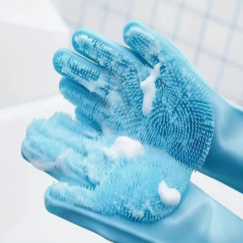 Blue grooming gloves with textured surface and soap suds on a white background