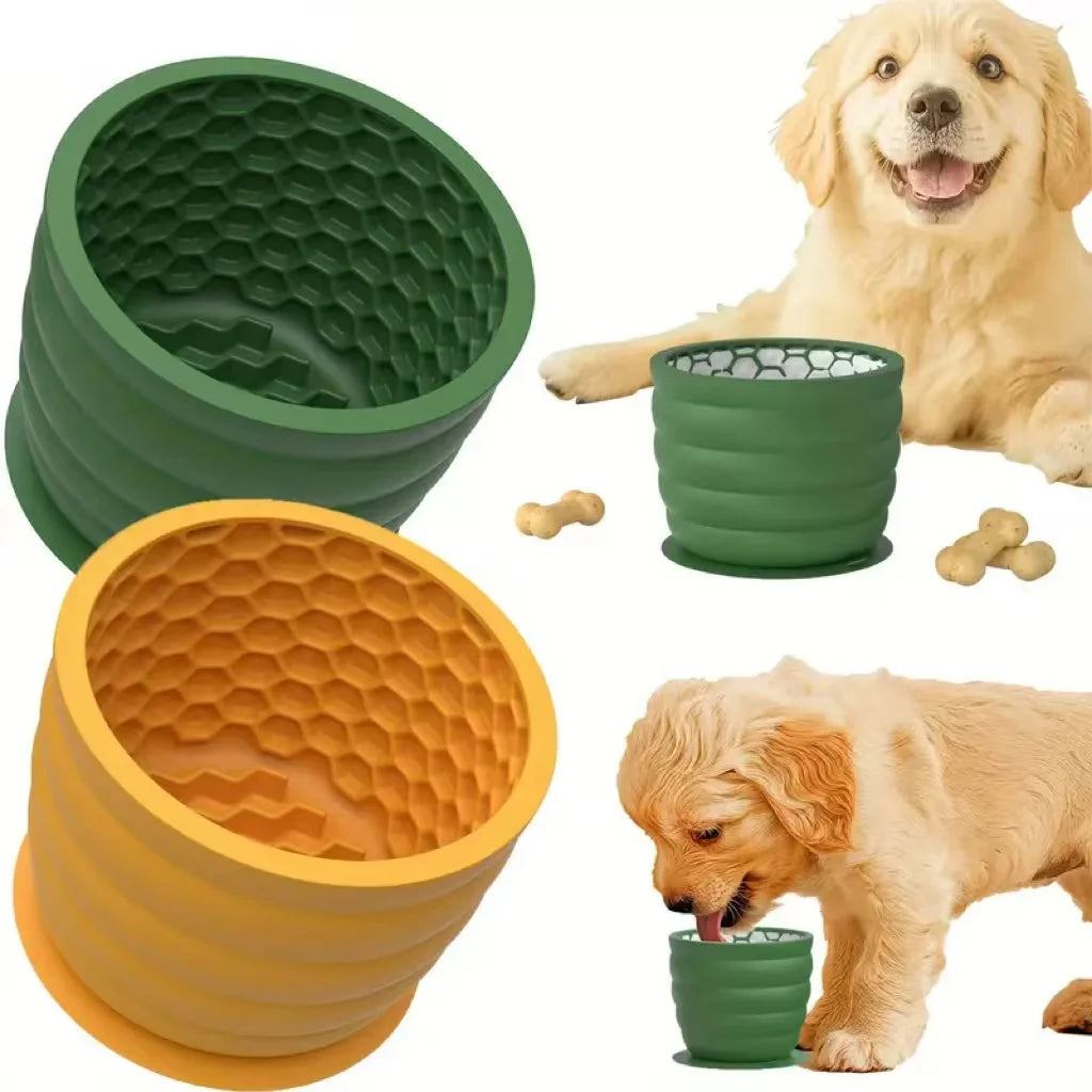 Collapsible silicone pet bowls in green and yellow with a dog and puppy interacting.