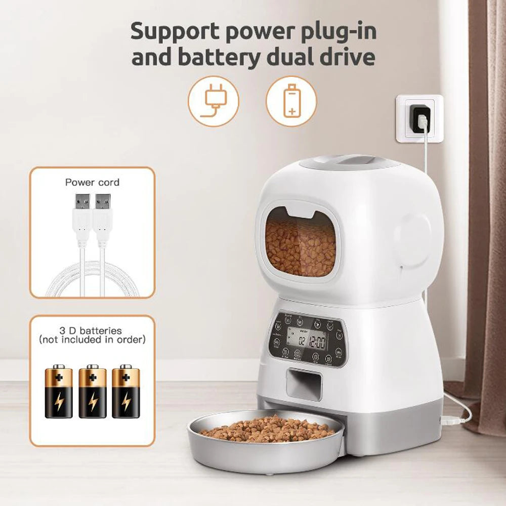 White pet food dispenser with power cord and batteries on a neutral background